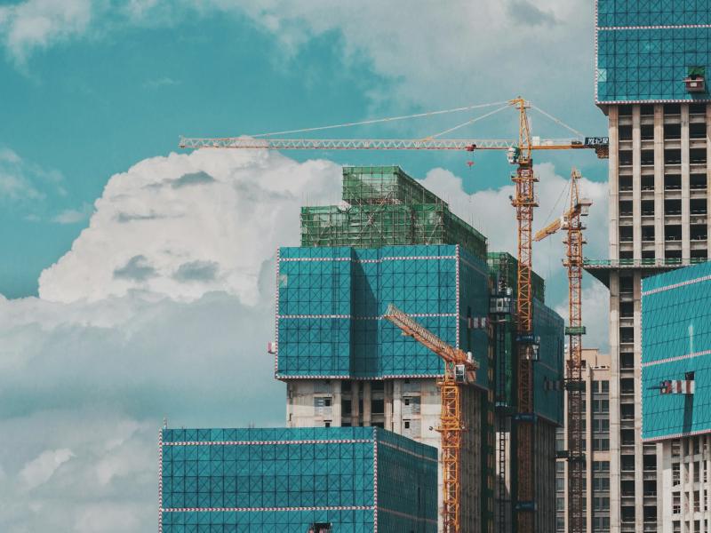 Multistory building under construction with cranes